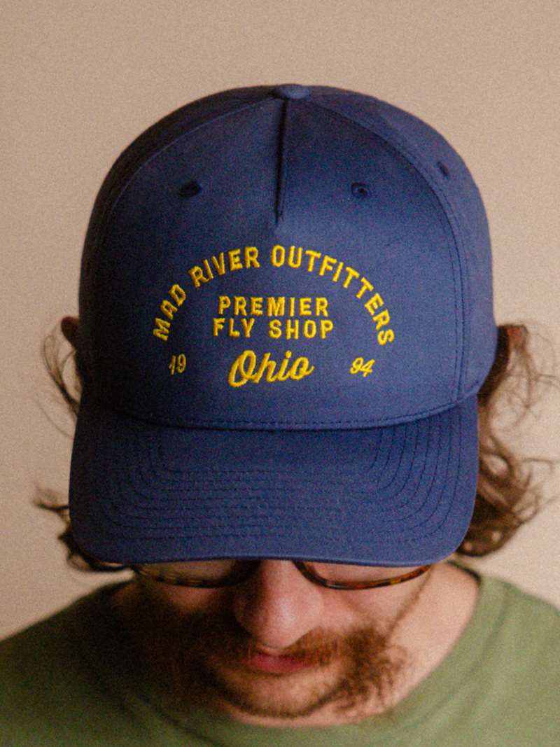 The Mad River Outfitters Pinch Front Hat features the new for 2026 "MRO Premier" Logo.